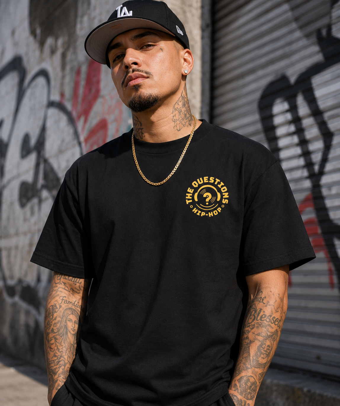 Superpower Tee worn — gold crest on the chest of a black heavyweight tee